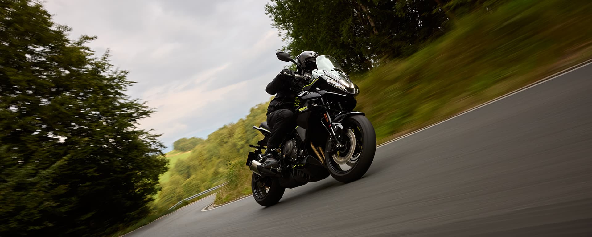 Triumph Tiger Sport 800 riding shot on road