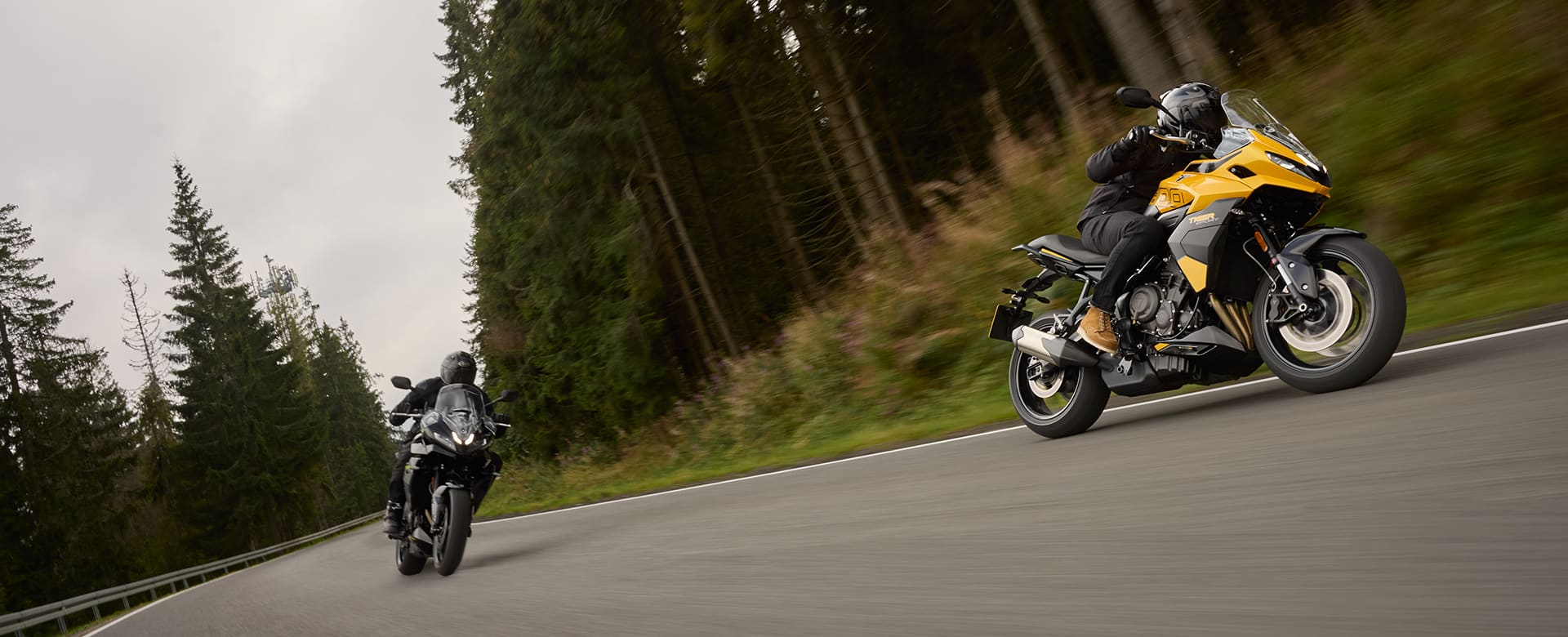 Triumph Tiger Sport 800 riding shot two bikes on the road