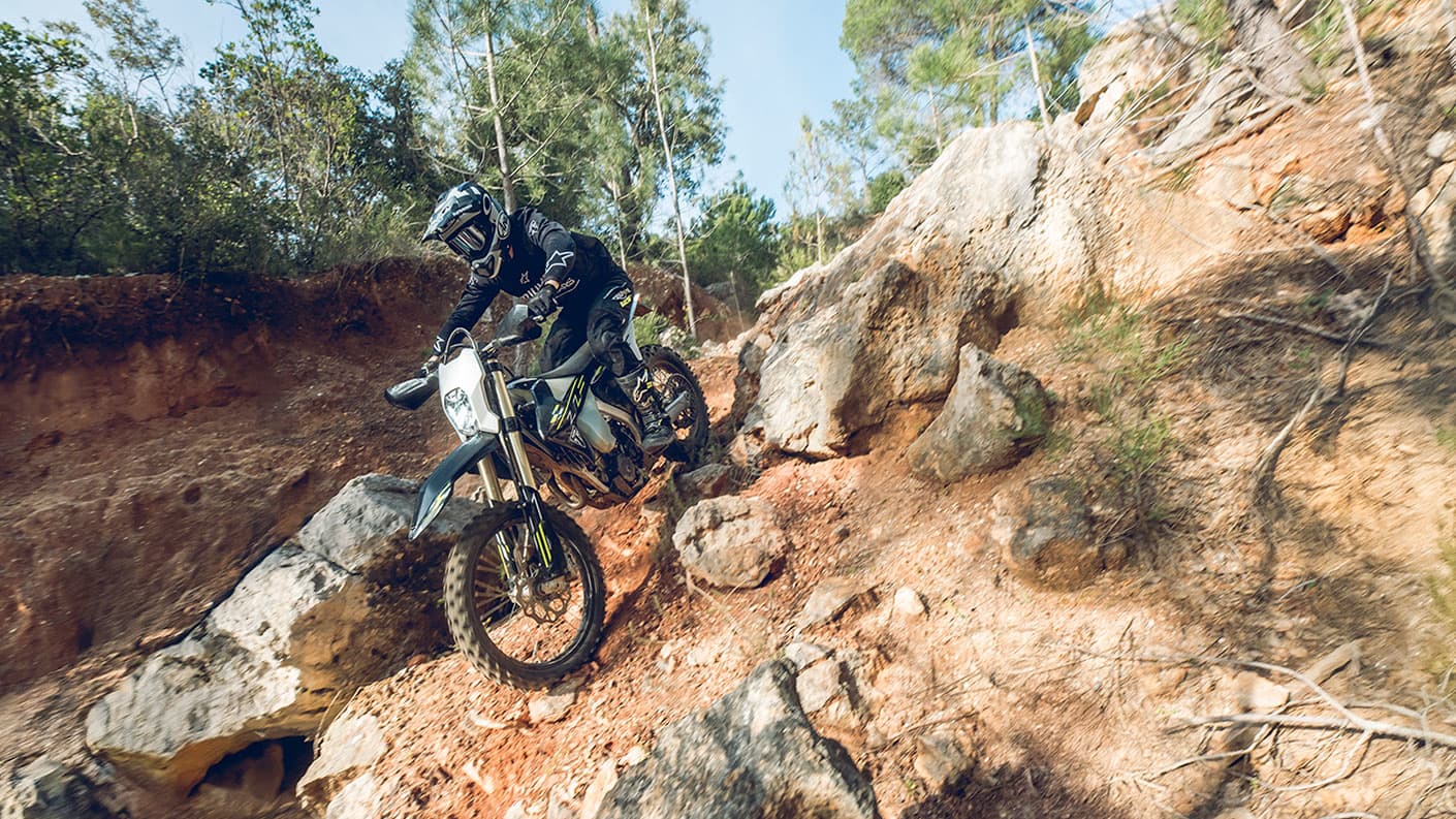 Triumph TF 250-E riding shot down a hill