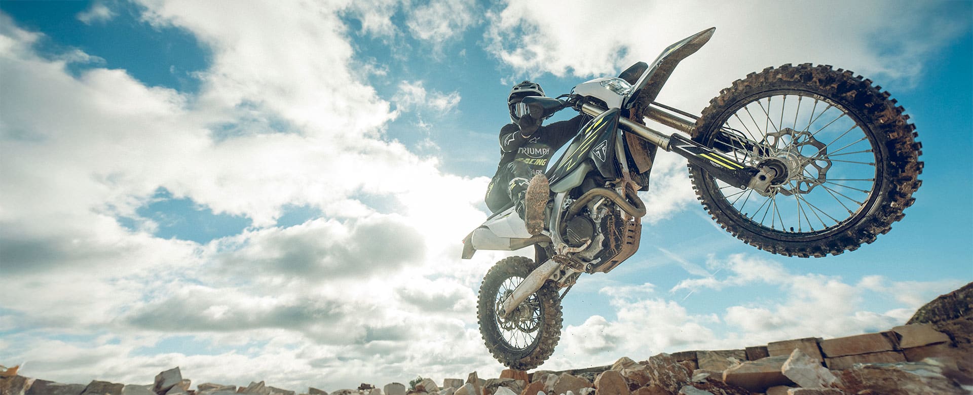 Triumph TF 450-E riding shot front wheel in the air