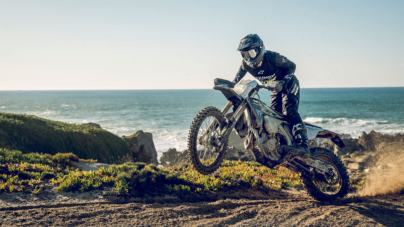 Triumph TF 450-E riding shot on the coast