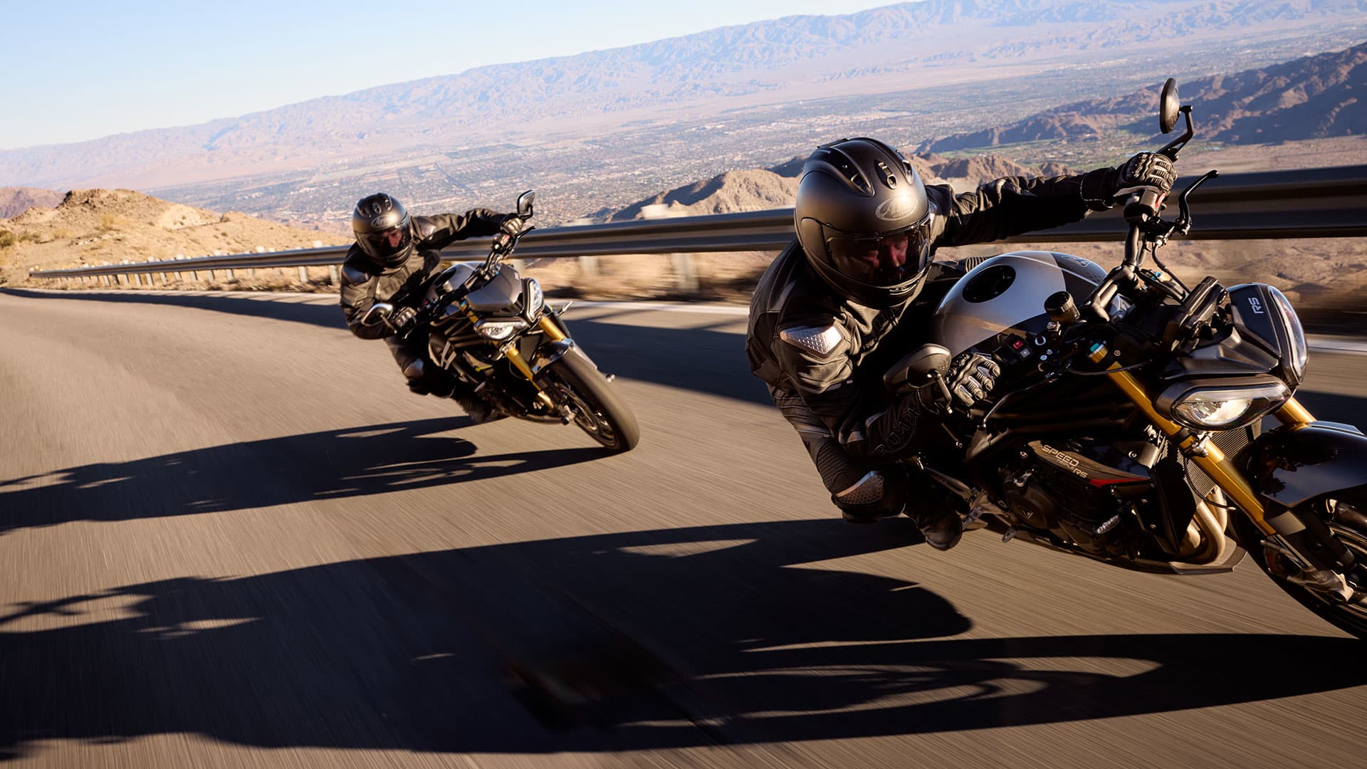 Two riders on the Triumph Speed Triple 1200 RS)