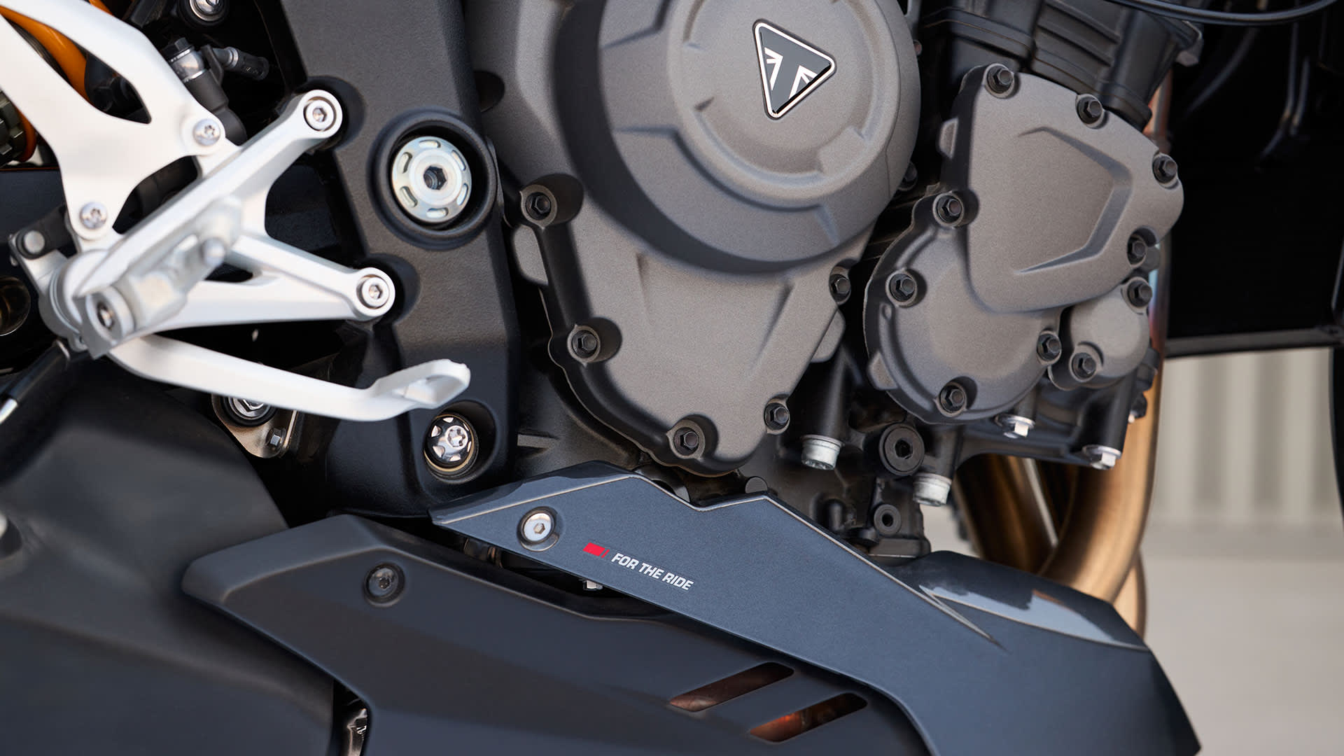 Triumph Speed Triple 1200 RS close up of the engine and bellypan