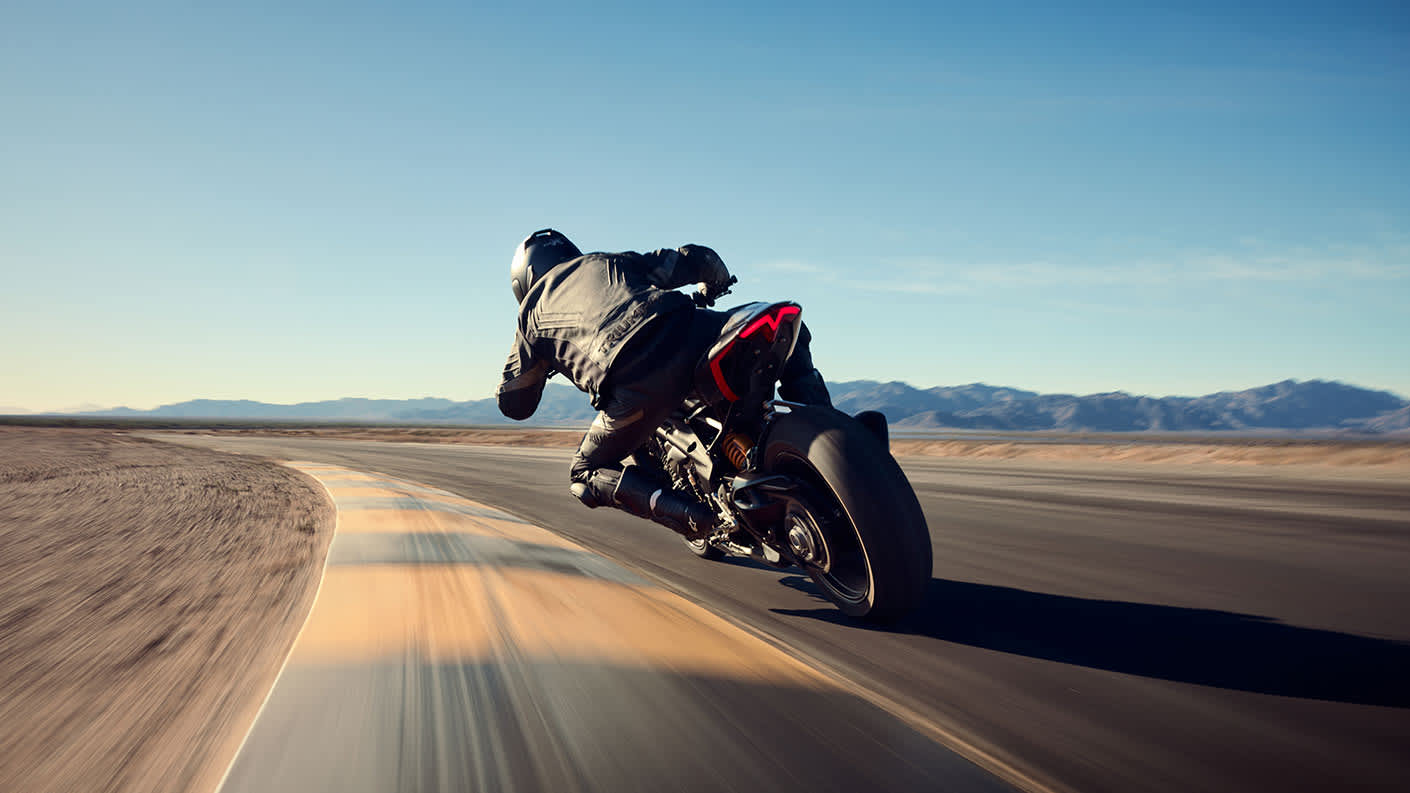 Triumph Speed Triple 1200 RS rear end riding shot