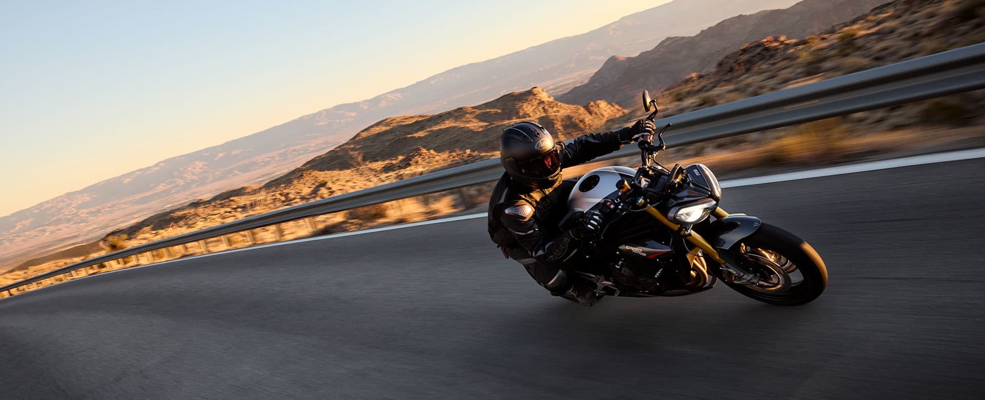 Triumph Speed Triple 1200 RS riding around a bend