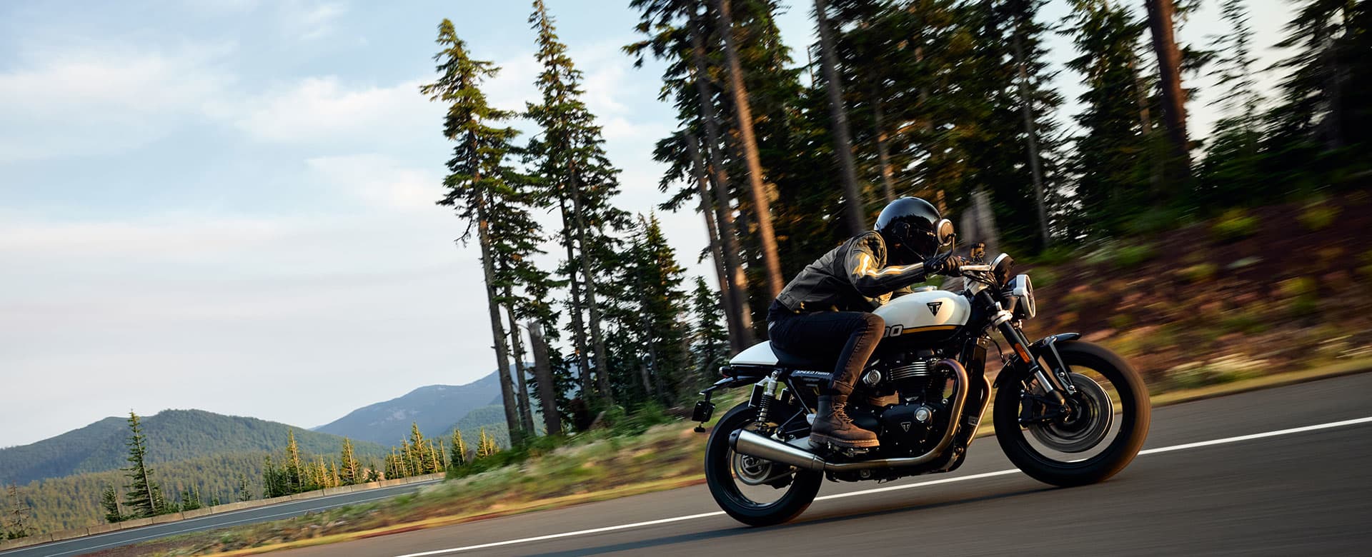 Triumph Speed Twin 1200 bike riding shot on the road