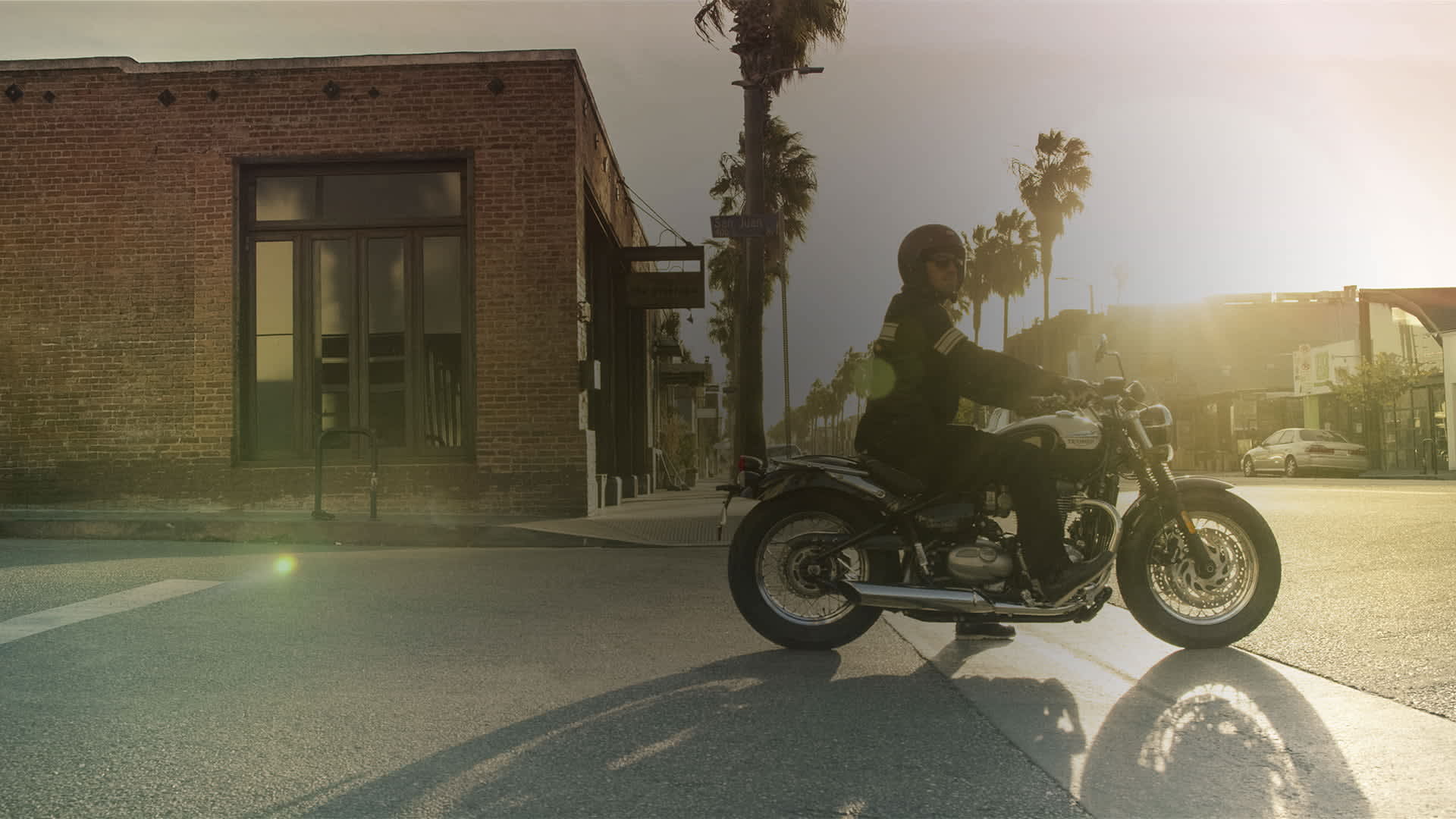 Person on a Speedmaster stopped at a crossroad. 